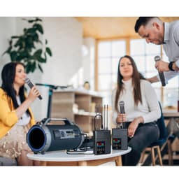 Langaton mikrofonijärjestelmä ulvomisenestolla ja kaikulla