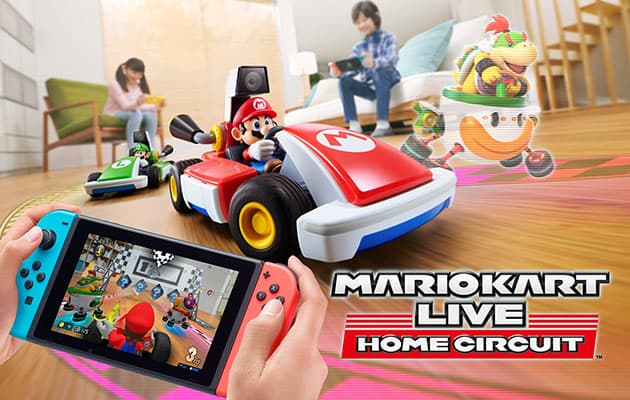 mariokart live home circuit med nintendo switch og figurer ute på gulvet