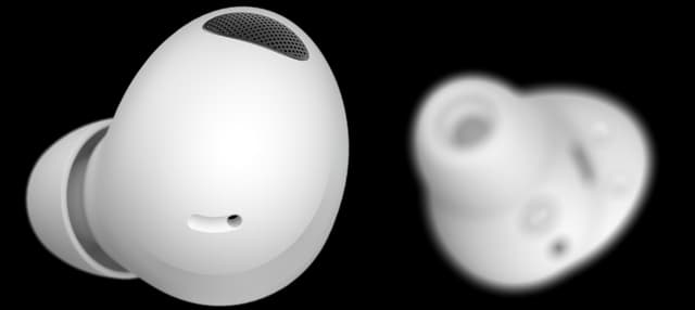 Närbild av vita Samsung Galaxy Buds2 Pro, en ur fokus i bakgrunden och en med skarpt fokus