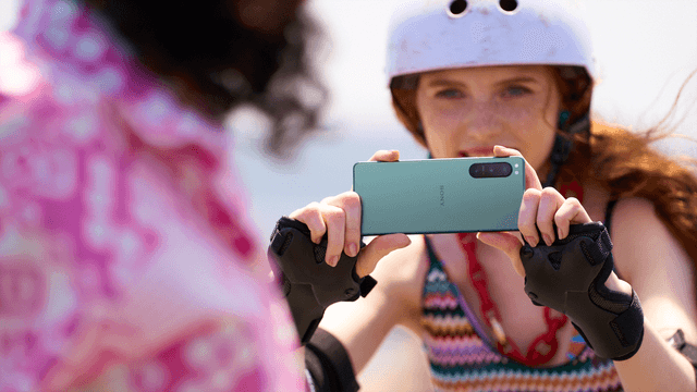Woman taking picture with Sony phone