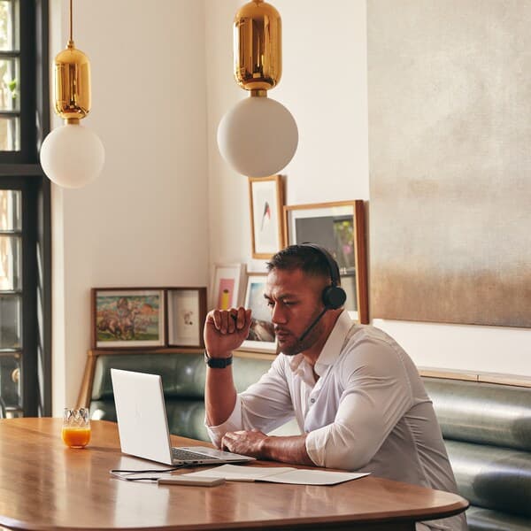 Man sitting in a cafe and working