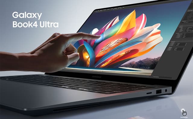 Galaxy Book4 Ultra med et farverigt billede på skærmen og en hånd, der rører ved den