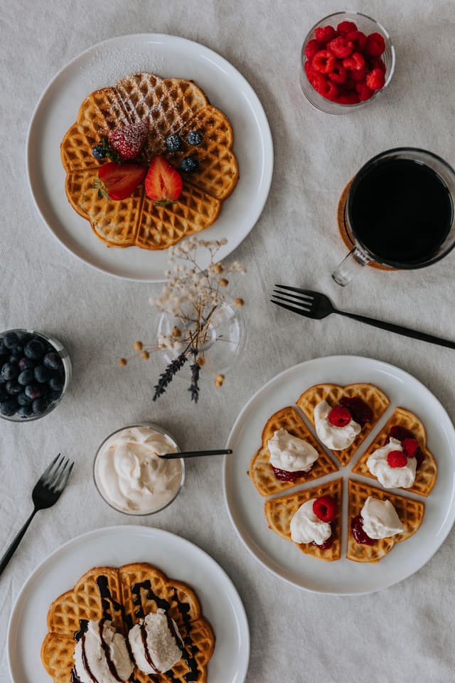 Three waffle plates on table