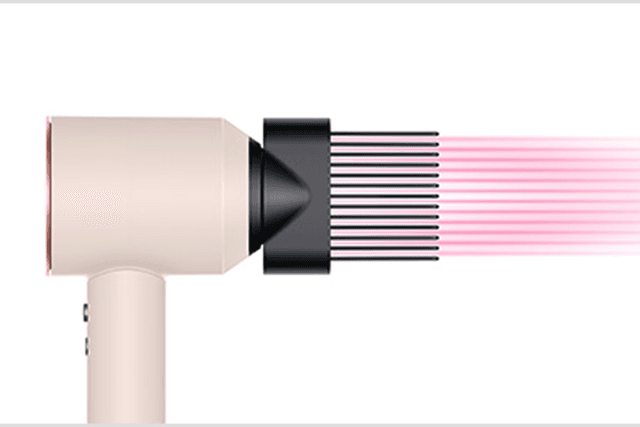 Dyson Supersonic hairdryer with a wide-tooth comb attachment