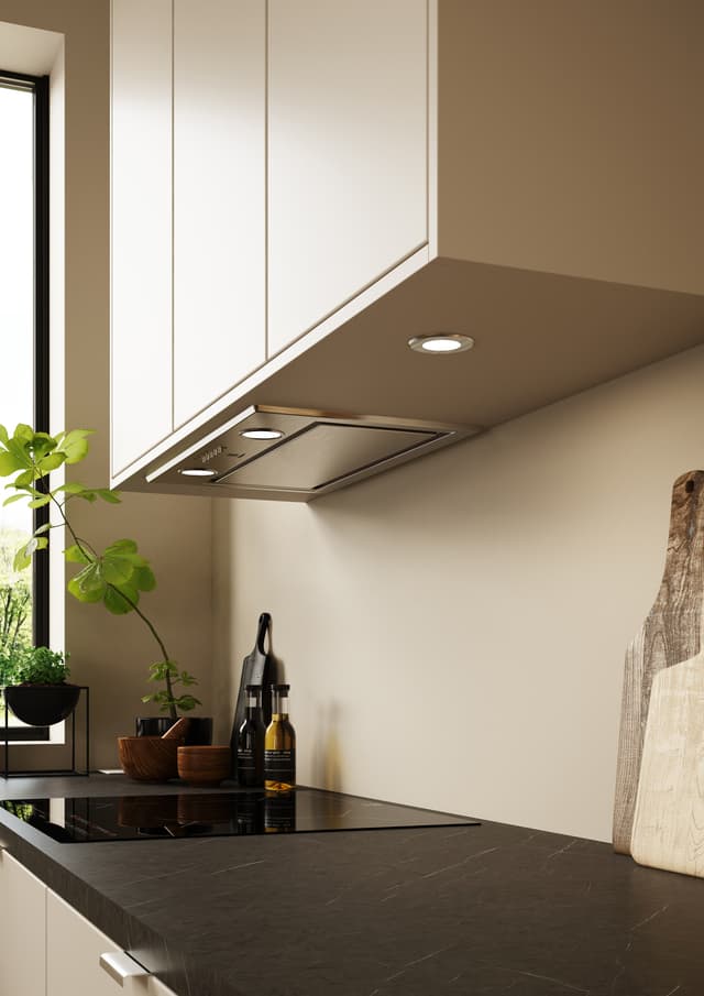 Closeup of hood and beige kitchen