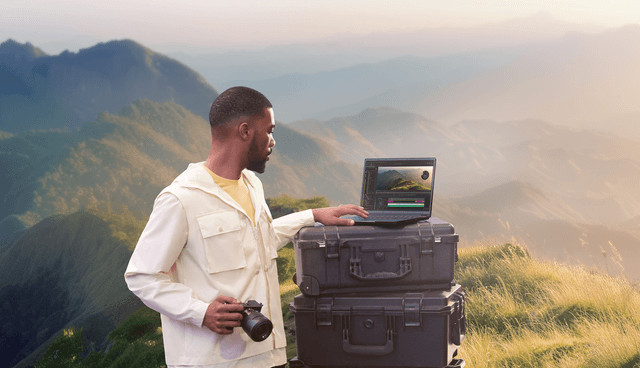 Asus - Computing - Man outdoors with his Asus ProArt Flip PX13 laptop and a camera in his hand