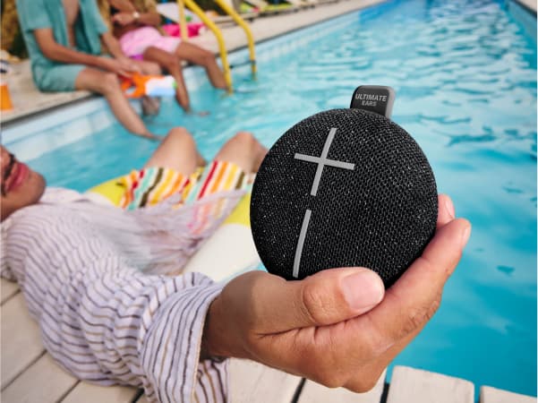 Ultimate Ears Miniroll in front of pool