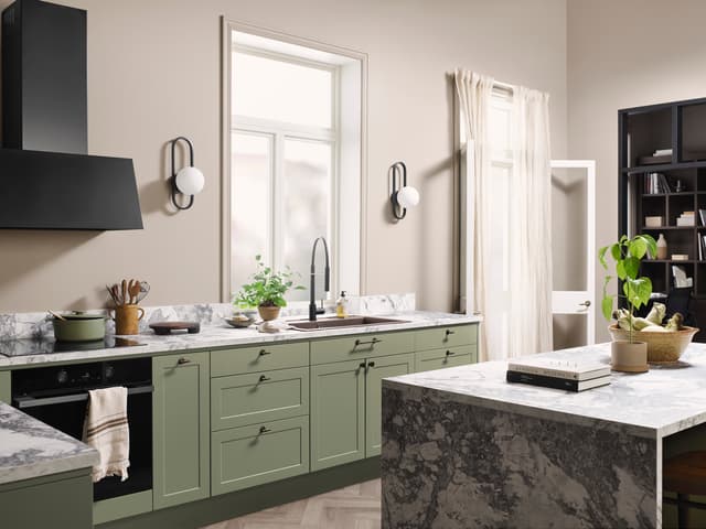 EPOQ - Light green Epoq Canvas kitchen in colour Olive and a kitchen island with stone worktop