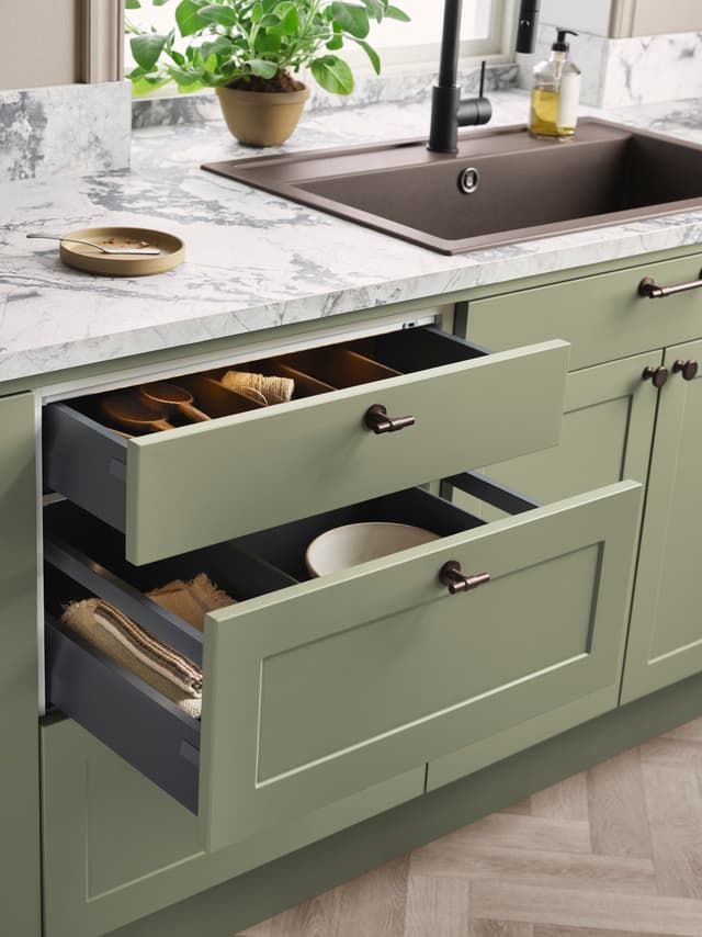 Epoq Canvas Pale Olive kitchen with light green drawers and light marble worktop