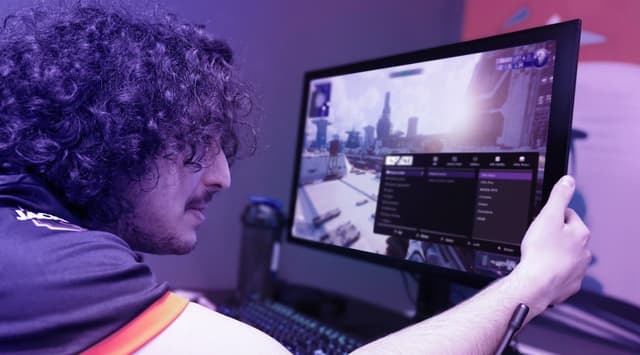 Sony Inzone monitor M10S and tournament-ready setting and a man next to the screen