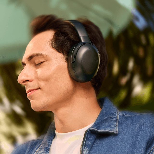 JBL Tour One M3 headphones on a man and Immersive JBL Spatial 360 sound with Head Tracking