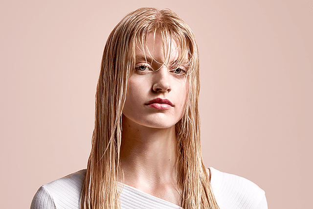 Dyson Airstrait™ straightener - Light haired girl with long damp wet hair