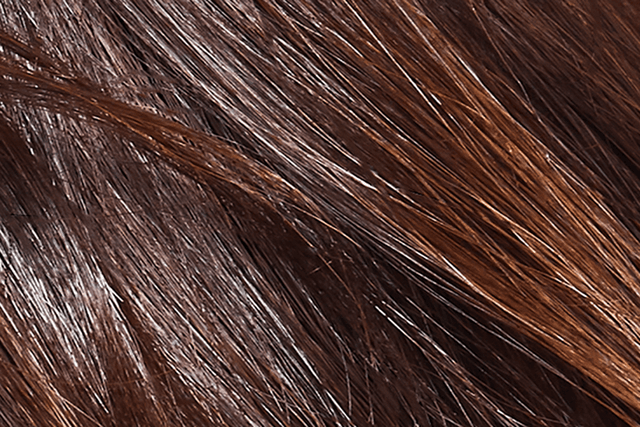 Dyson Airstrait™ straightener - Close-up of brown hair 