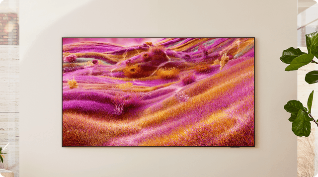 Samsungin QN90F-sarjan televisio beigeä seinää vasten olohuoneessa