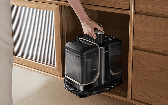 Person storing Dreame N10 carpet cleaner in closet