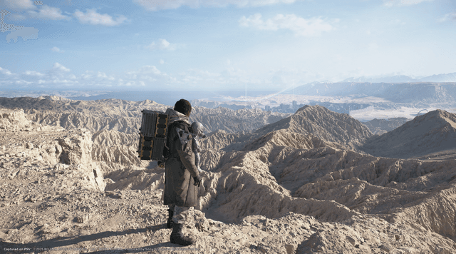 Screenshot fra Death Stranding 2: On the Beach - person i ørkenlandskab