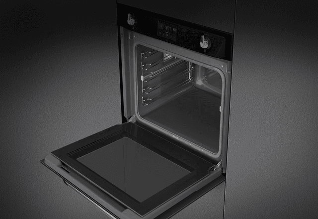 Integrated SMEG combination oven in a dark grey kitchen