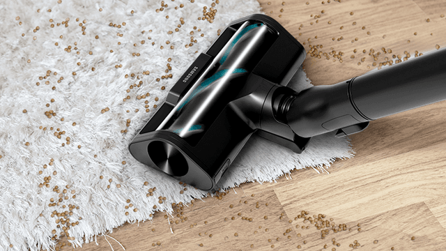 Samsung Bespoke Jet AI Ultra vacuuming crumbs on a carpet