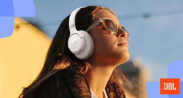 Woman wearing JBL wireless headphones in white