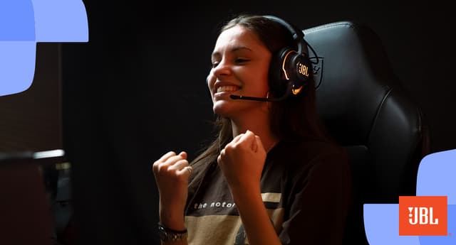 Girl with JBL gaming headset looking excited
