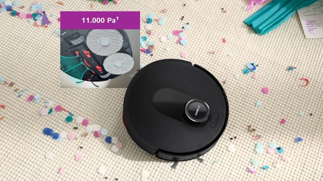 Bosch Spotless Max robotdammsugare på en matta täckt med konfetti, med en infälld bild som visar undersidan och sugkraften.