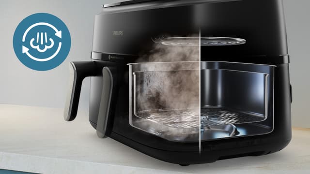 Indersiden af Philips Airfryer 5000, mens Steam Clean‑funktionen klarer arbejdet