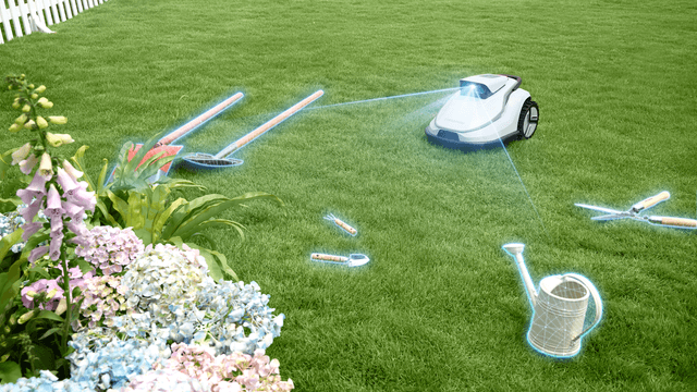 En Terramow-robotgressklipper oppdager hageutstyr på plenen med sensoren sin.