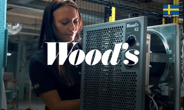 Woods indoor climate products next to a woman
