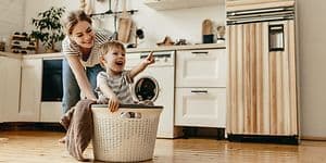 CS - Extended Warranty - A woman and child playing with a laundry basket