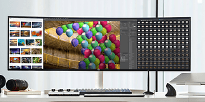 En UltraWide ekstra bred skärm med färglada bilder i fotoprogram