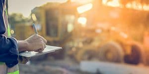 Construction worker using tablet outdoors on the work site