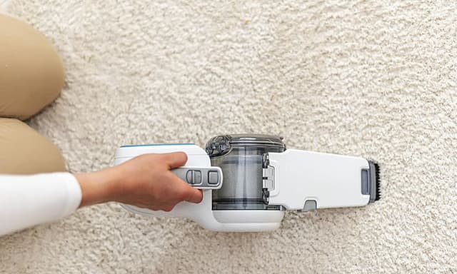 Handheld unit on a white carpet