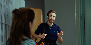 services - home technician - technician being greated by the door