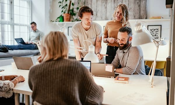 A small group of people in a meeting