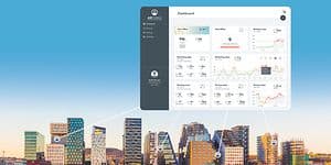 Airthings dashboard framför bild över ett stadslandskap