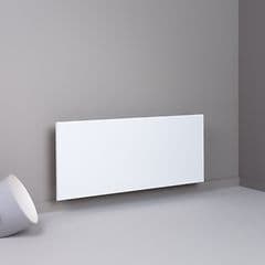 Ett vitt Adax Neo element på en beige vägg.