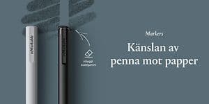 En vit och en svart penna, reMarkable markers, ligger på en gön bakrgund med text. 