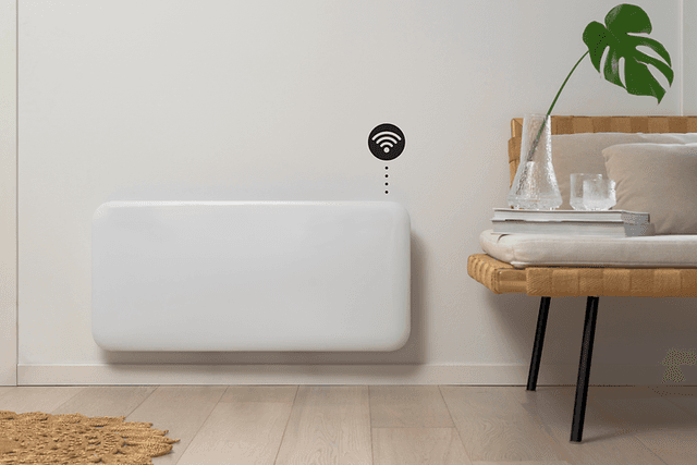 Smart heater on a wall with wifi symbol and interior in front
