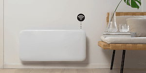 Smart heater on a wall with wifi symbol and interior in front