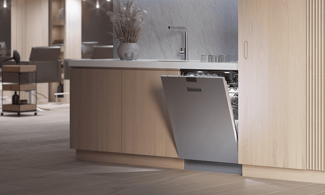 Asko diskmaskin i titan placerad i en salong