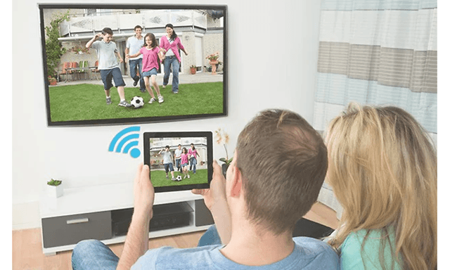 Couple using chromecast from a tablet