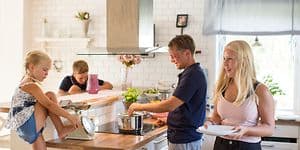 Family in a kitchen preparing food