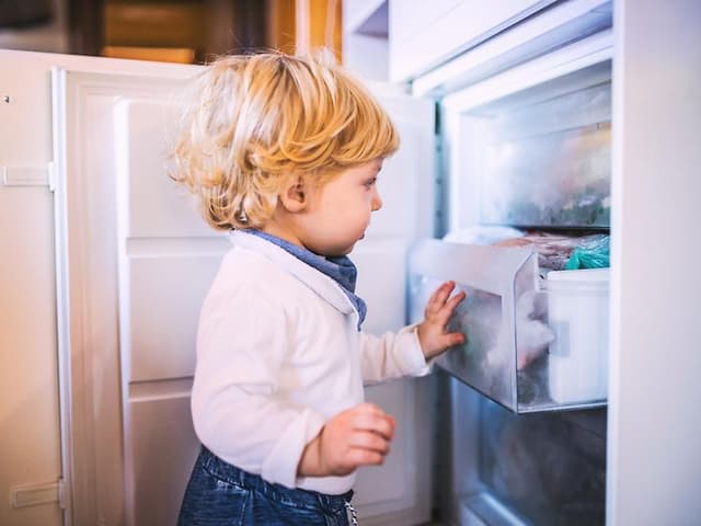 MDA-Freezers-Little boy opening a freezer