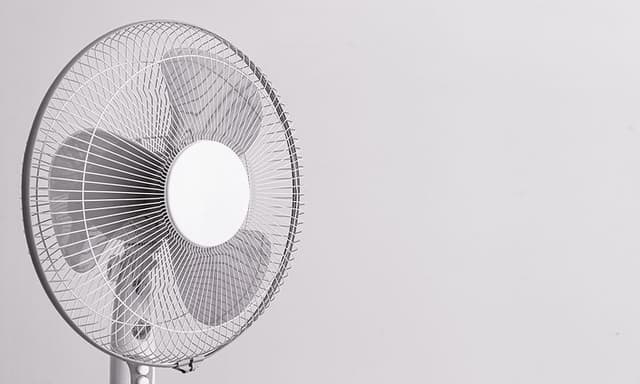 The head of a cooling fan on grey background