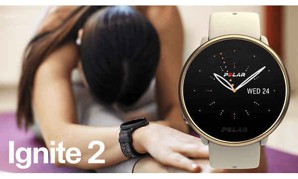 Polar - A Polar Ignite smartwatch on the wrist of woman doing yoga