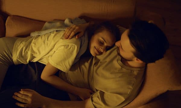  Couple hugging in sofa