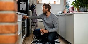 Man checking the oven