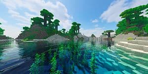 Kuvakaappaus Minecraft-pelistä, jossa vesistö ja paljon vehreää kasvistoa