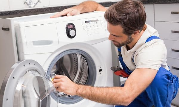 MDA-Washing machine-handy man fixing a broken washing machine