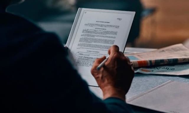 Man writing on a remarkable